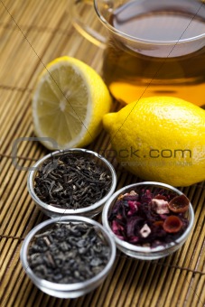 Glass cup of tea with lemon