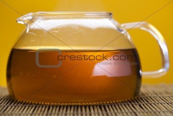 Glass teapot of tea