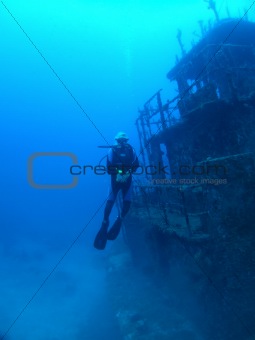 Diver next to wreck