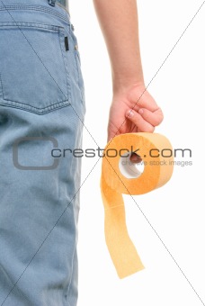 Roll of yellow toilet paper in hand