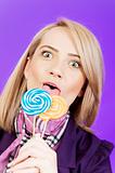 Girl with lollipop against colourful background