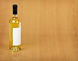 Bottle of white wine on wooden table