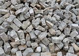 Pile of natural gray stone bricks closeup