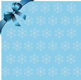Snowflakes blue background with blue ribbon and bow. Place for c