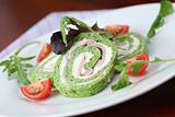 Spinach roll with cheese and ham