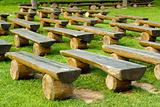 outdoor wood seating on green lawn
