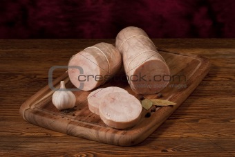 Composition with meat roll on the table