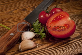 Tomatoes on the old wooden table