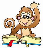 Cute monkey reading book