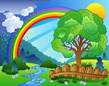 Landscape with rainbow and tree