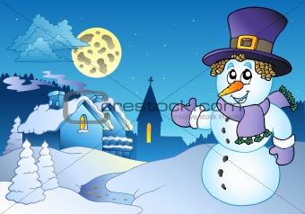 Snowman near small village