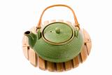 Green teapot on stand