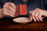old hands and coffee cup