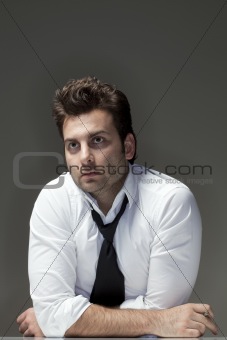 man in white shirt looking up, thinking - isolated on gray