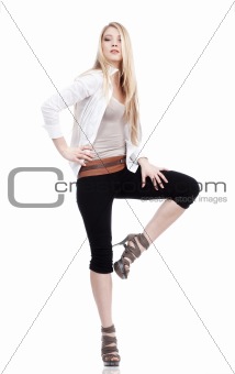 young woman with blond hair standing - isolated on white