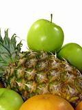 Pineapple and green apples isolated on a white background 