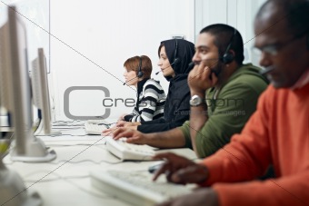 students with headset in computer lab