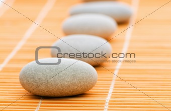 Stack of spa pebbles against blurred background