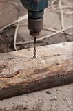 Drill drilling  wooden board