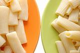 Macaroni foods in orange and green plates