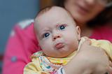Little 4-month boy pouts his lips