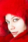 Young attractive woman in red fur-cap