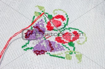 Needlework. Cloth with needle, thread and embroidered batterfly