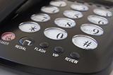 Telephone with focused buttons: vip, review; flash