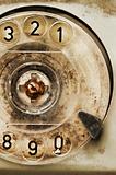 Grunge: rotary dial of old broken phone