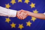 hand shake over european flag