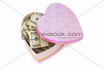 Heart shaped gift box and dollars inside