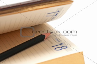 Pencil in an open diary