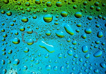 Many little water drops on the glass(yellow,blue)