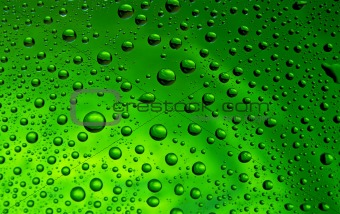 Many little water drops on the glass(green)