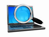 laptop and magnify glass