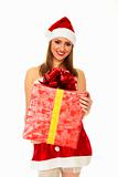 Cheerful santa helper girl with big gift box