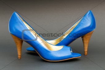 Fashion concept with blue woman shoes on high heels