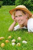 Young woman and easter eggs on the grass - Easter time