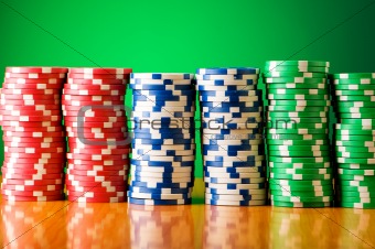 Stack of casino chips against gradient background