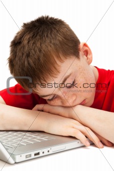 sleeping boy with a laptop