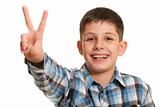 Happy boy showing a victory sign