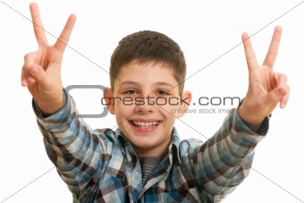 Laughing  boy showing a victory sign