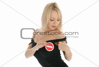 Woman undresses and holds prohibiting sign