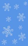 Falling snowflakes on a blue background