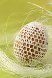 Easter egg with white crochet decoration