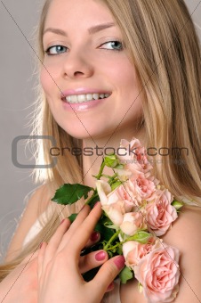 Smiling girl with roses