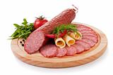 Sliced sausage with vegetables isolated