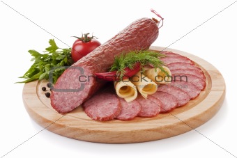 Sliced sausage with vegetables isolated