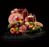 A composition of meat and vegetables with beer