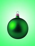 Green christmas ball on green background 